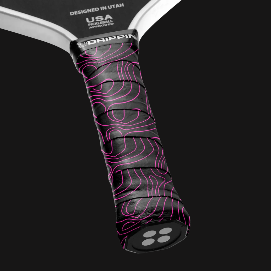 black pink pickleball grip with topographic pattern on paddle handle