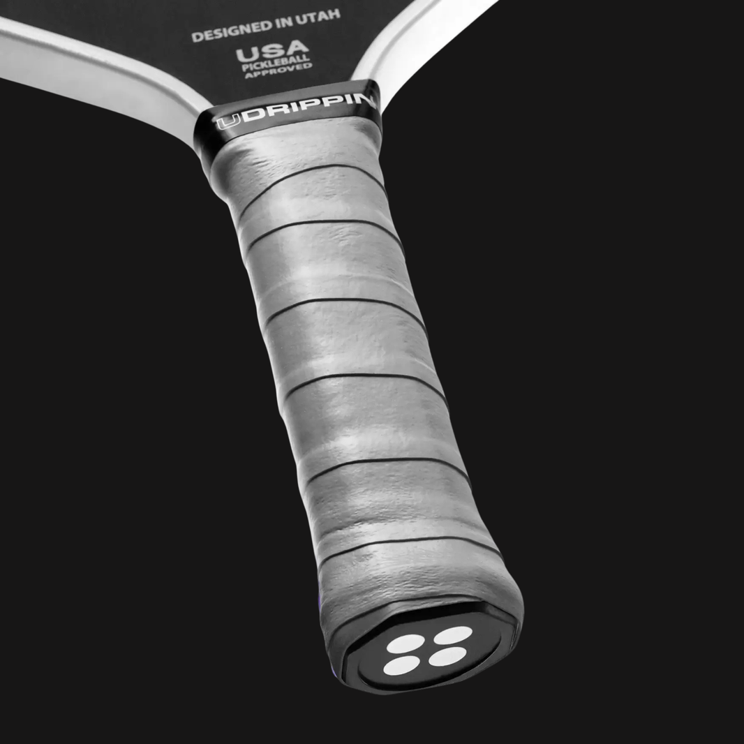 light grey pickleball grip on paddle handle